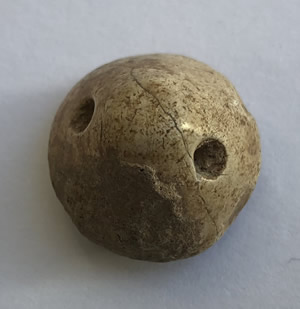 3200 BC Cr&egrave;me Calcite Conoid Stamp Seal with deep drilled grooves and dots forming a rosette design back with suspension hole