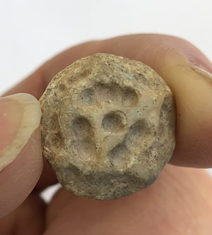 3200 BC Cr&egrave;me Calcite Conoid Stamp Seal with deep drilled grooves and dots forming a rosette design