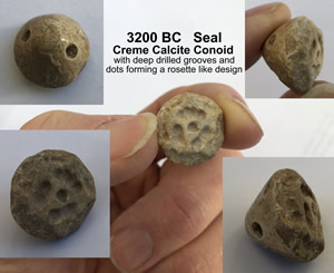 3200 BC Cr&egrave;me Calcite Conoid Stamp Seal with deep drilled grooves and dots forming a rosette design