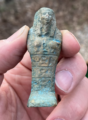 Turquoise blue glazed pottery faience Ushabti figure with hieroglyphic panels on the front from Egypt