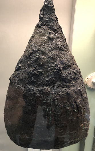 Assyrian helmet designed with a point to deflect blows and missiles