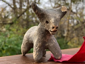 1000-600 BC Bull - Terracotta bull figurine grey-slipped with tapered legs, curved horns 