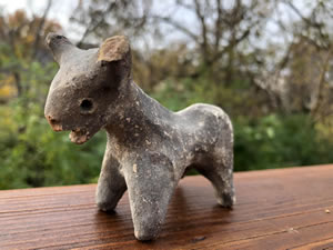 1000-600 BC Bull - Terracotta bull figurine grey-slipped with tapered legs, curved horns