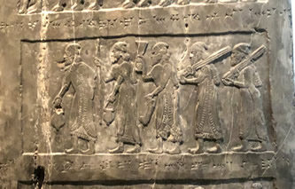 Israelite tribute bears for Israel's King Jehu in second row bring gold, golden bowl, golden tureen, golden vessels, golden pails, tin, spears and staffs of the kings hand